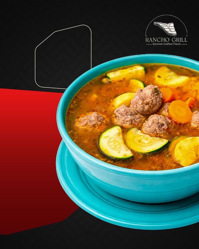 Albóndigas soup in turquoise bowl