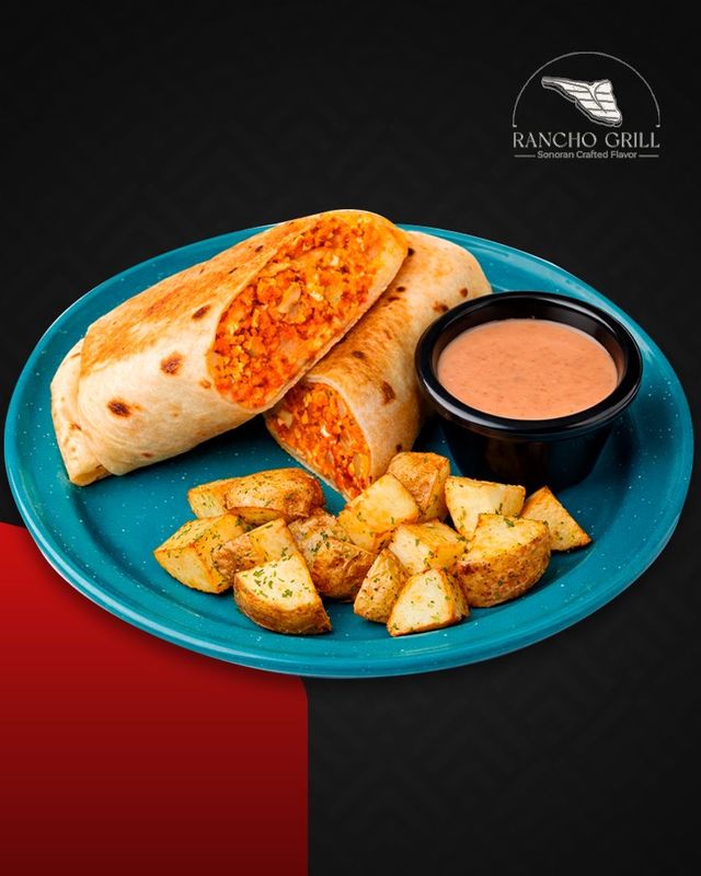 Breakfast burrito on turquoise plate